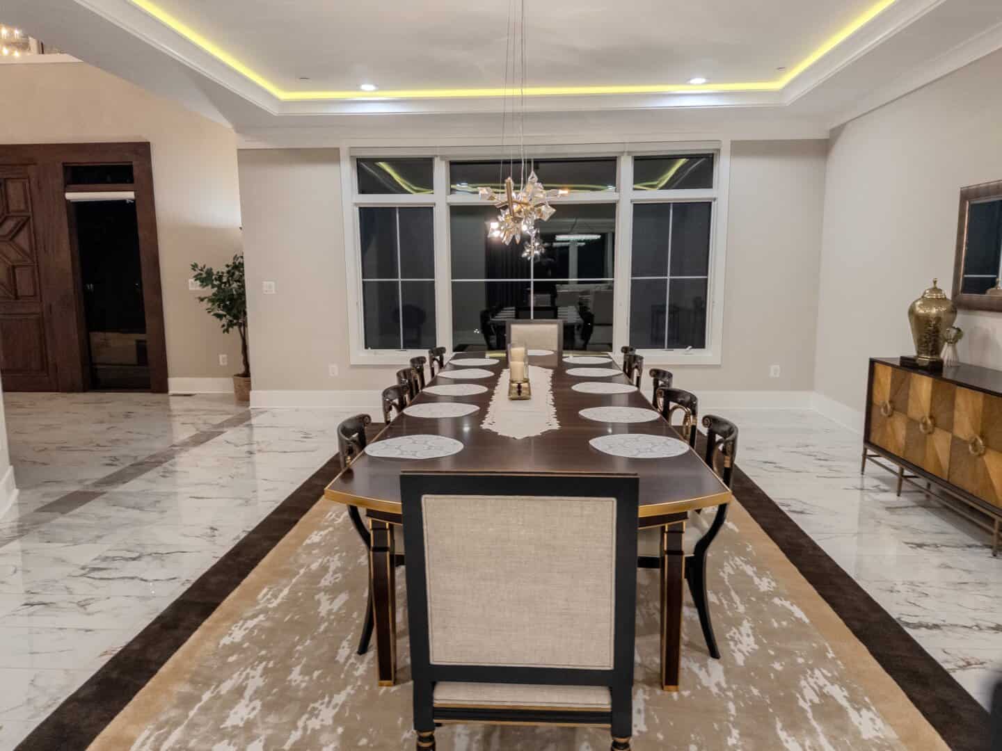 Photo of Noor Mahal's furnished main dining room; shot at night.